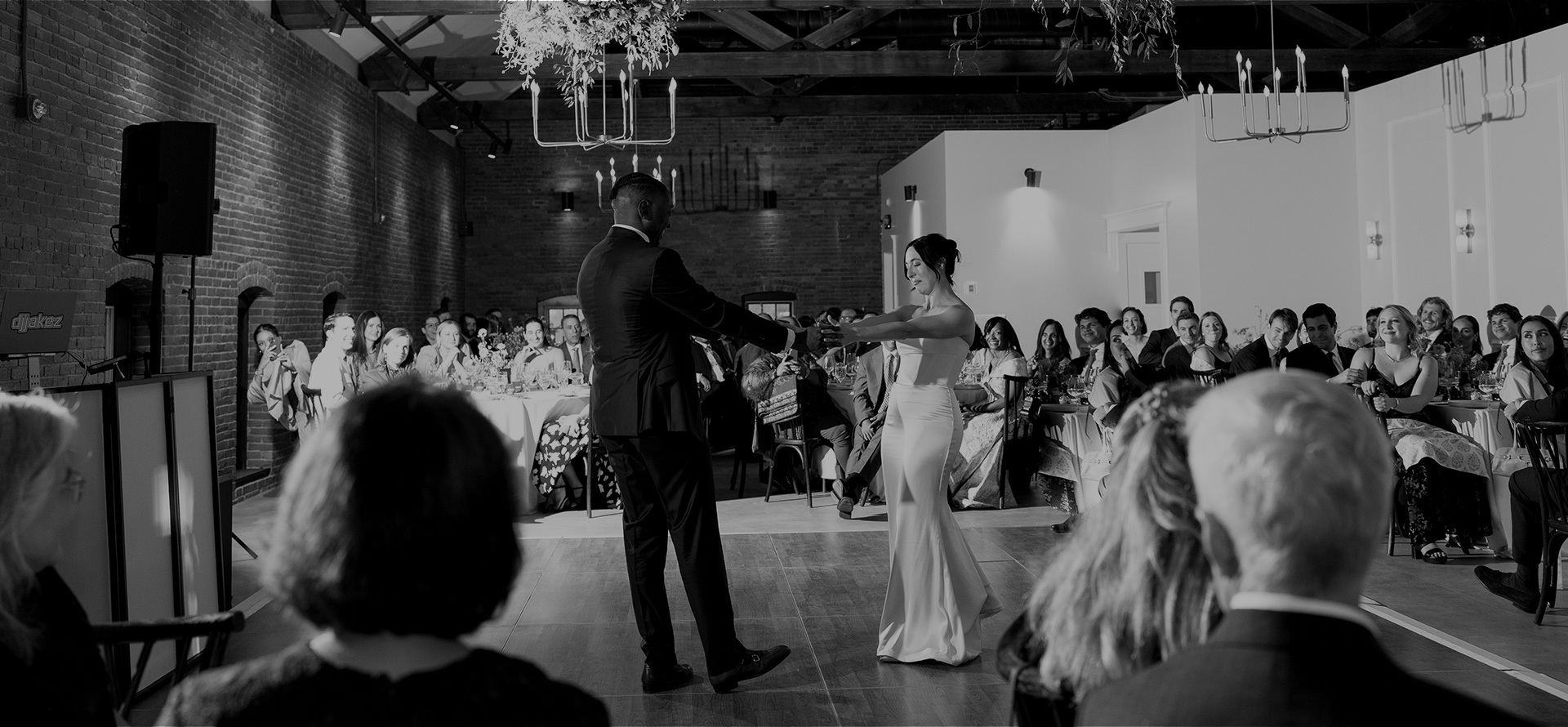 Wedding-Parallax-Hero-1920 bride and groom sharing a dance on the dance floor