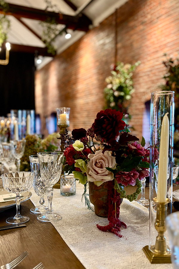 Floral centerpiece with elegant glassware