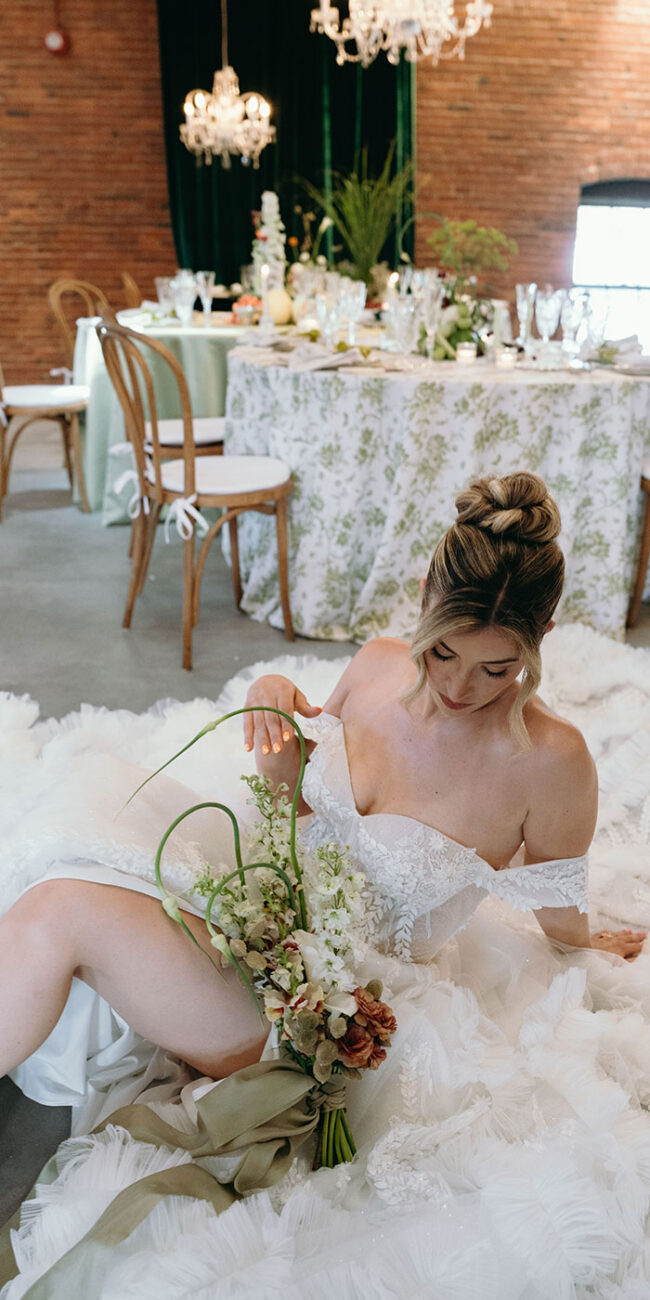 Bride posing with bouquet