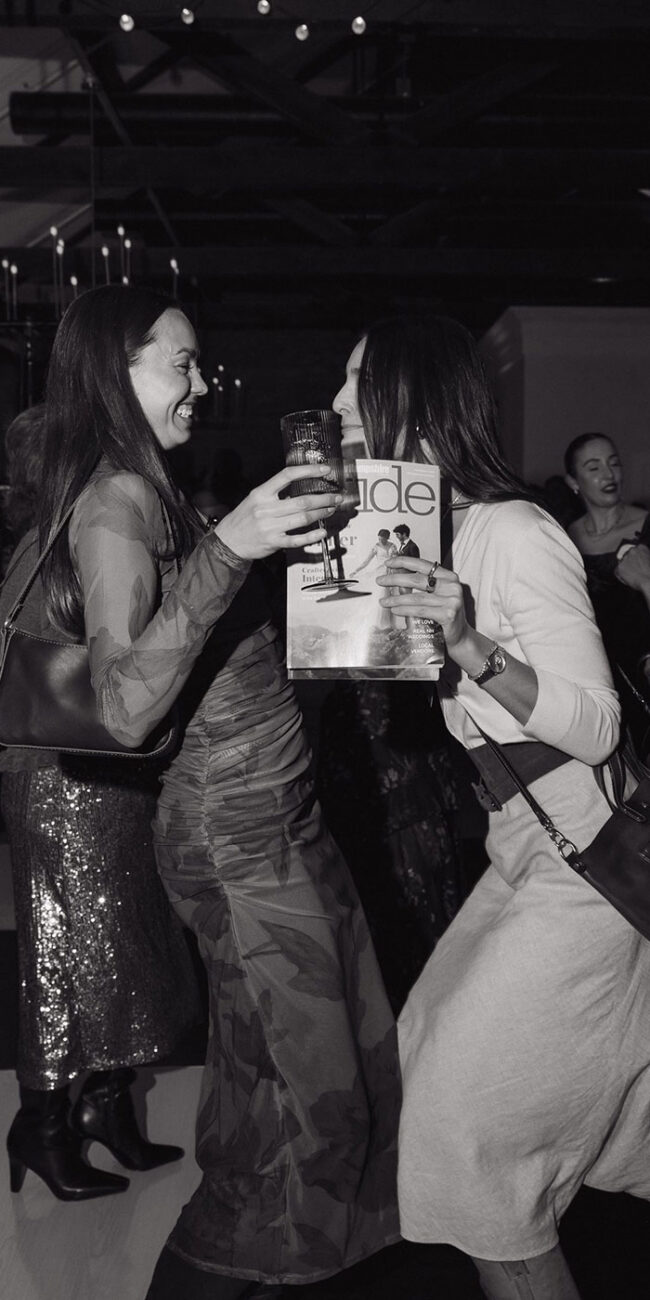 Two women dancing together at an event