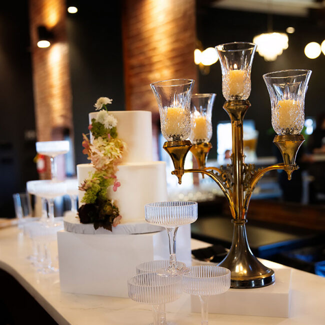 Candelabra on bar top with cake