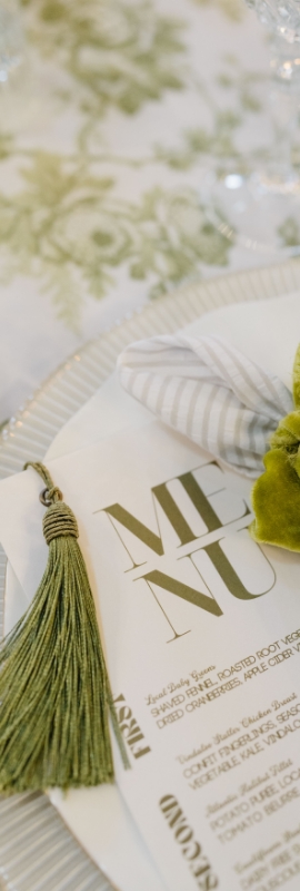 Elegant curated place setting on luxury linens and flatware