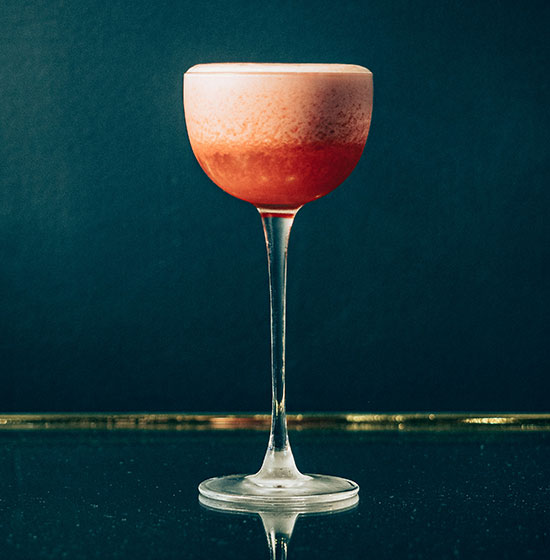 Fancy cocktail in couple glass