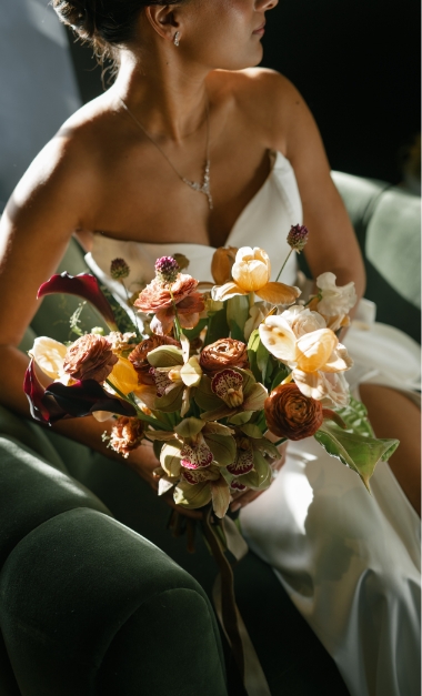 Gorgeous floral arrangement held by bride
