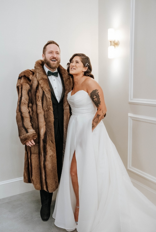 Elegant wedding couple at The Hawthorn in fur coat