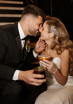 Bride and groom with cocktails