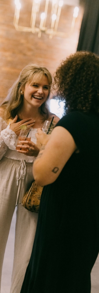 Two women talking and laughing together