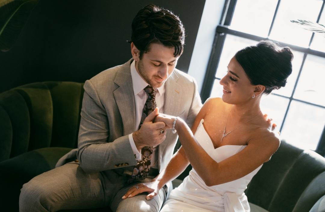 Wedding couple sitting on couch for consultation