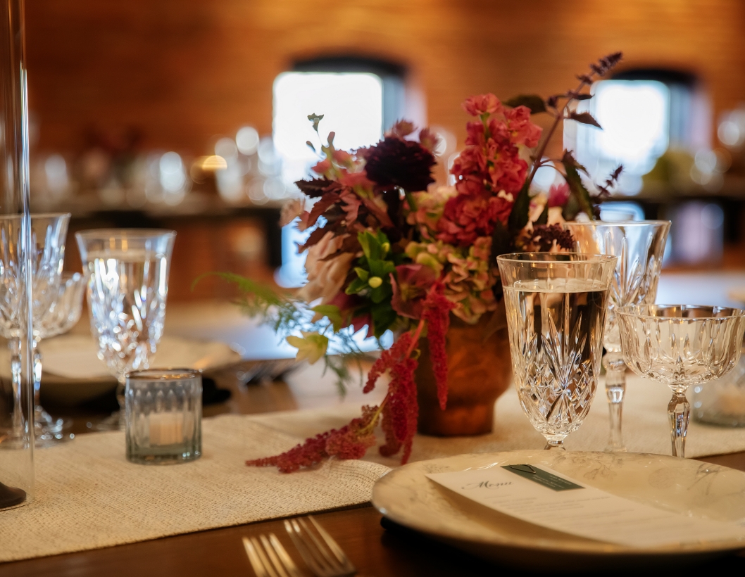 Event tablescape with flowers and crystal glasses
