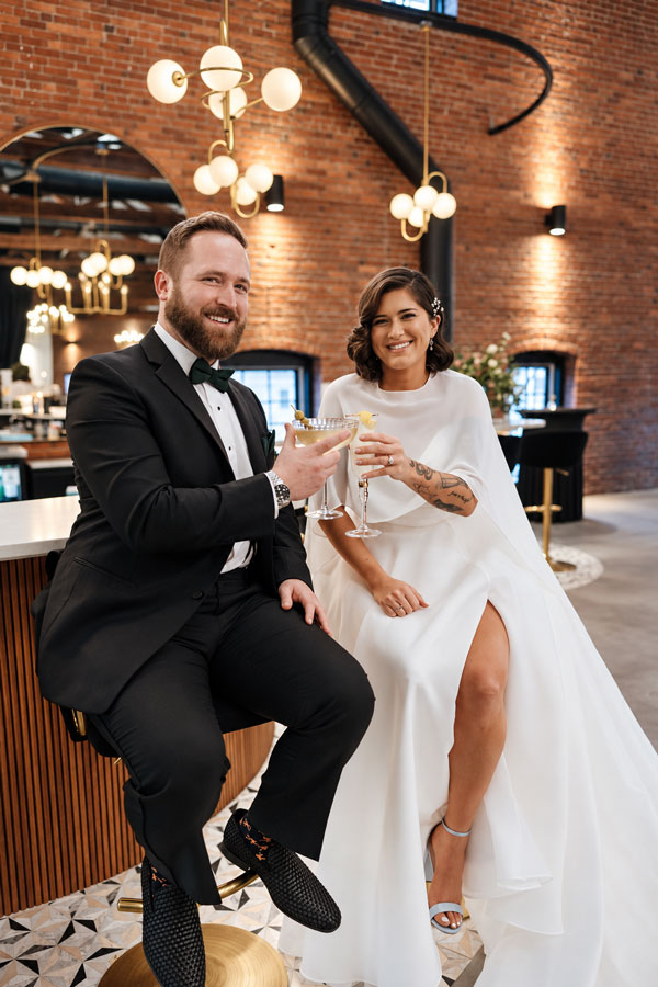 Elegant wedding couple cheers at the bar at The Hawthorn New Years Eve Wedding